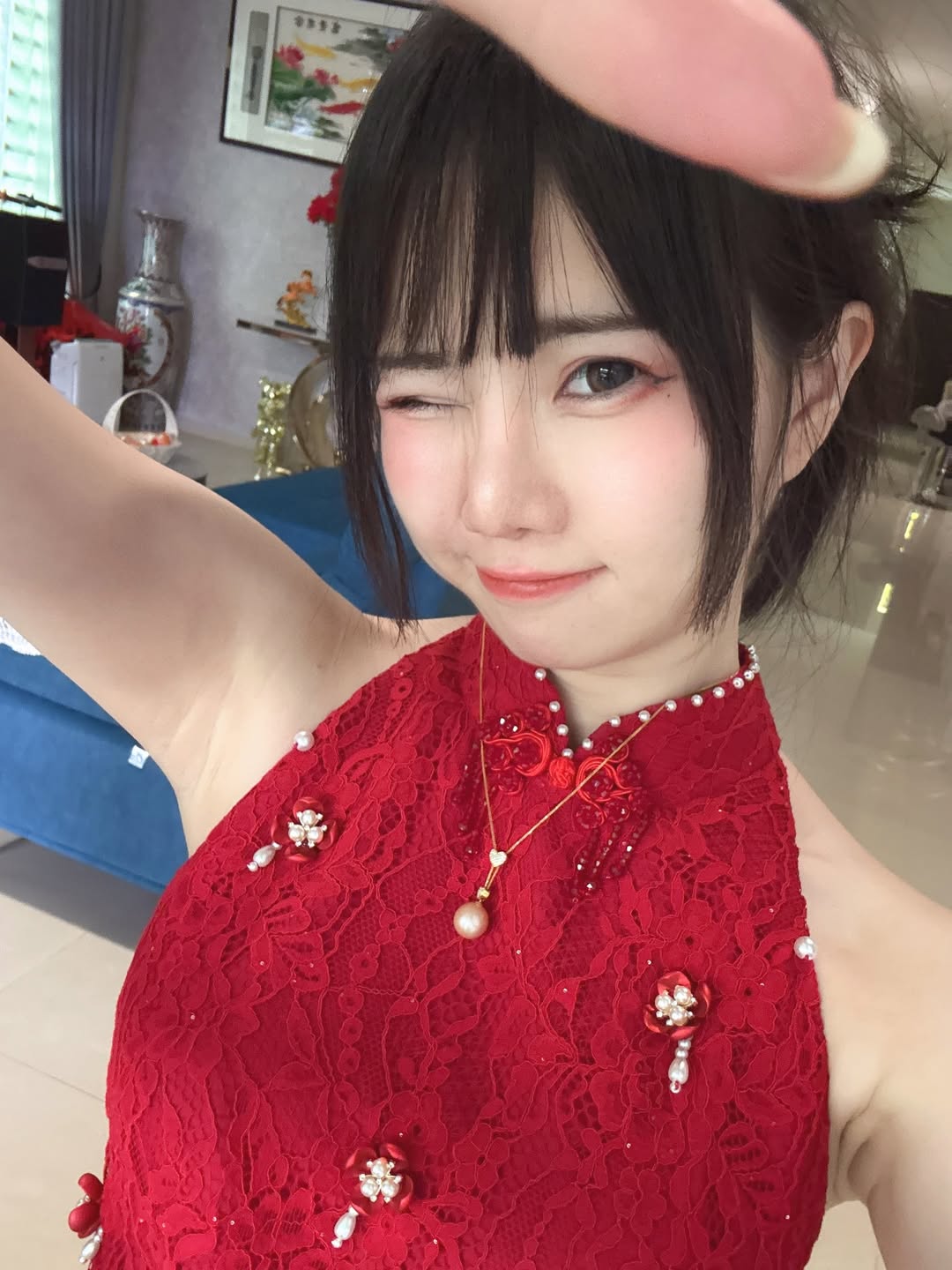 Cosplayer posing with peach blossoms