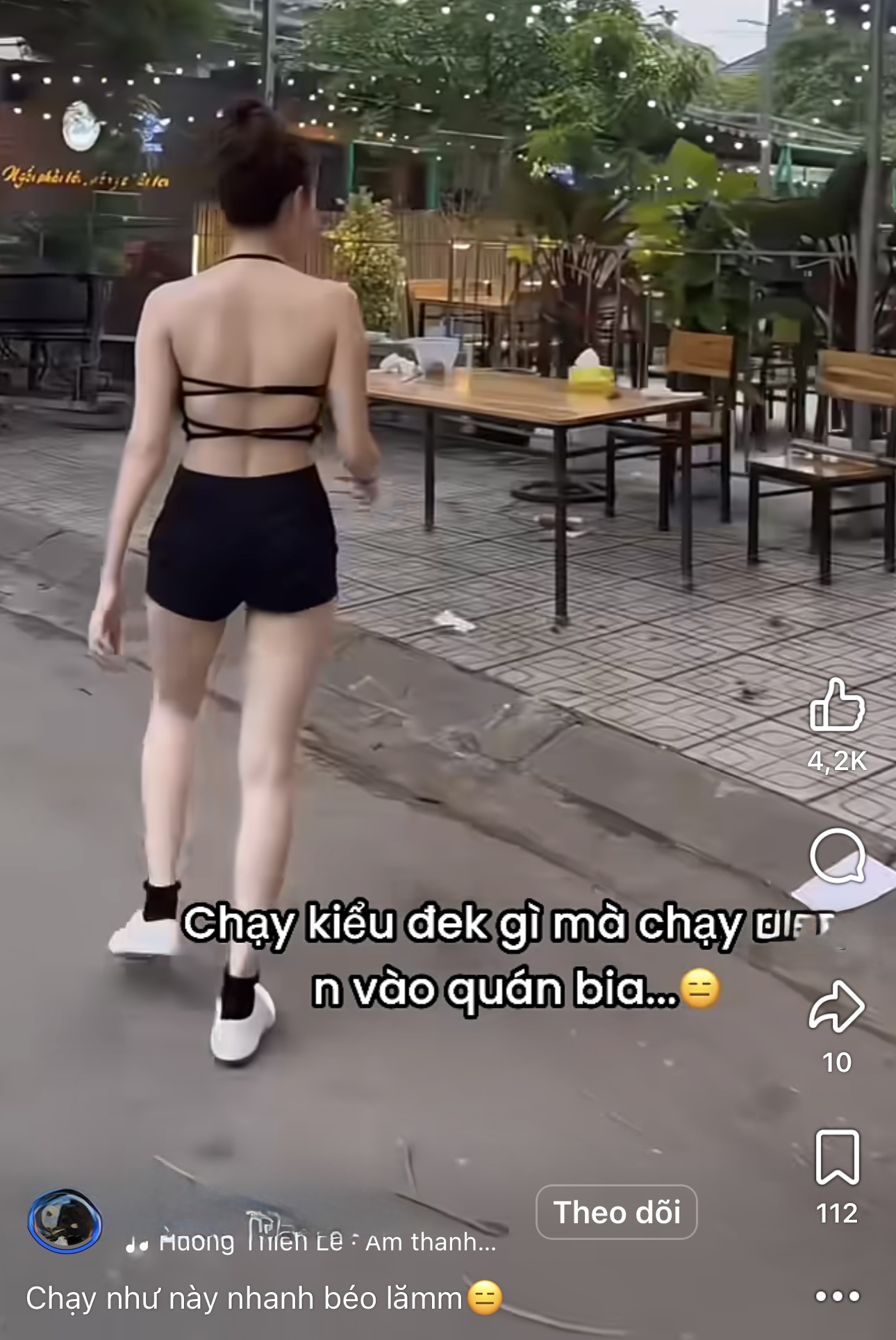 Young woman running in revealing workout clothes