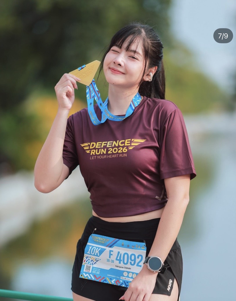 Meet Nahmfah: The Stunning Runner With a Hardcore Training Routine 2 Nahmfah smiling during a marathon