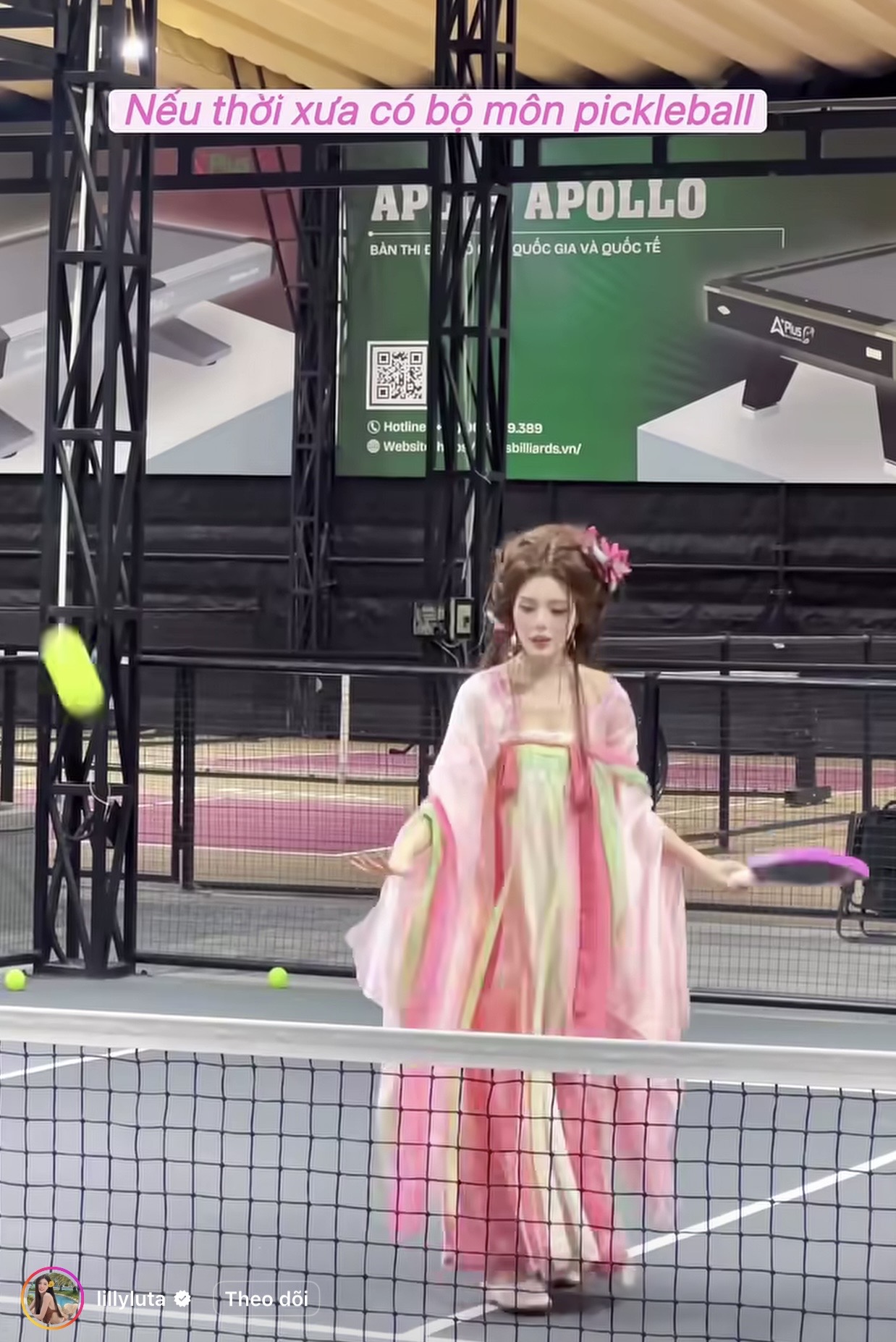 Lilly Luta in pastel traditional costume on Pickleball court