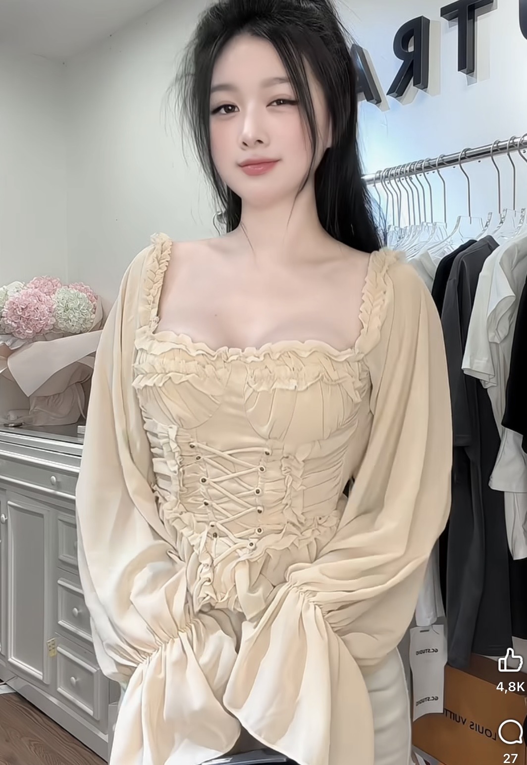 Pham Kieu Trang showcasing fashion pieces from her shop