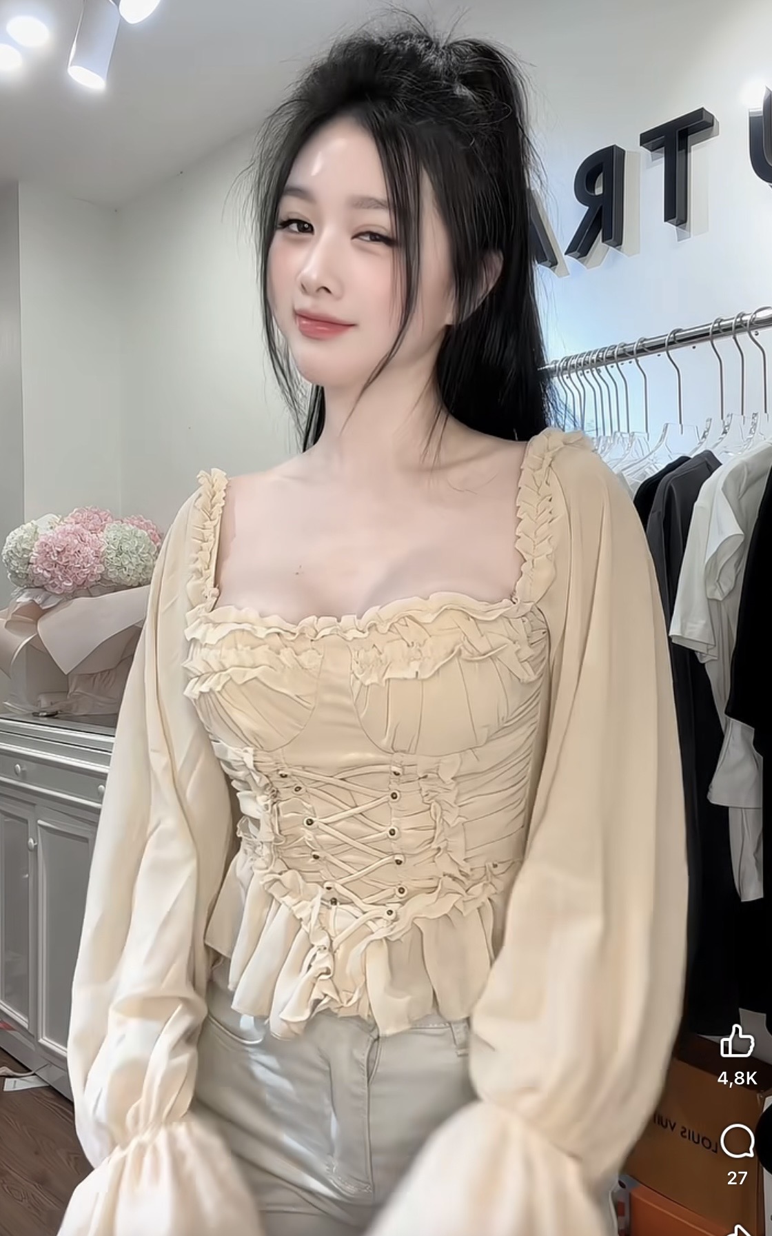 Pham Kieu Trang confidently posing in shop outfit