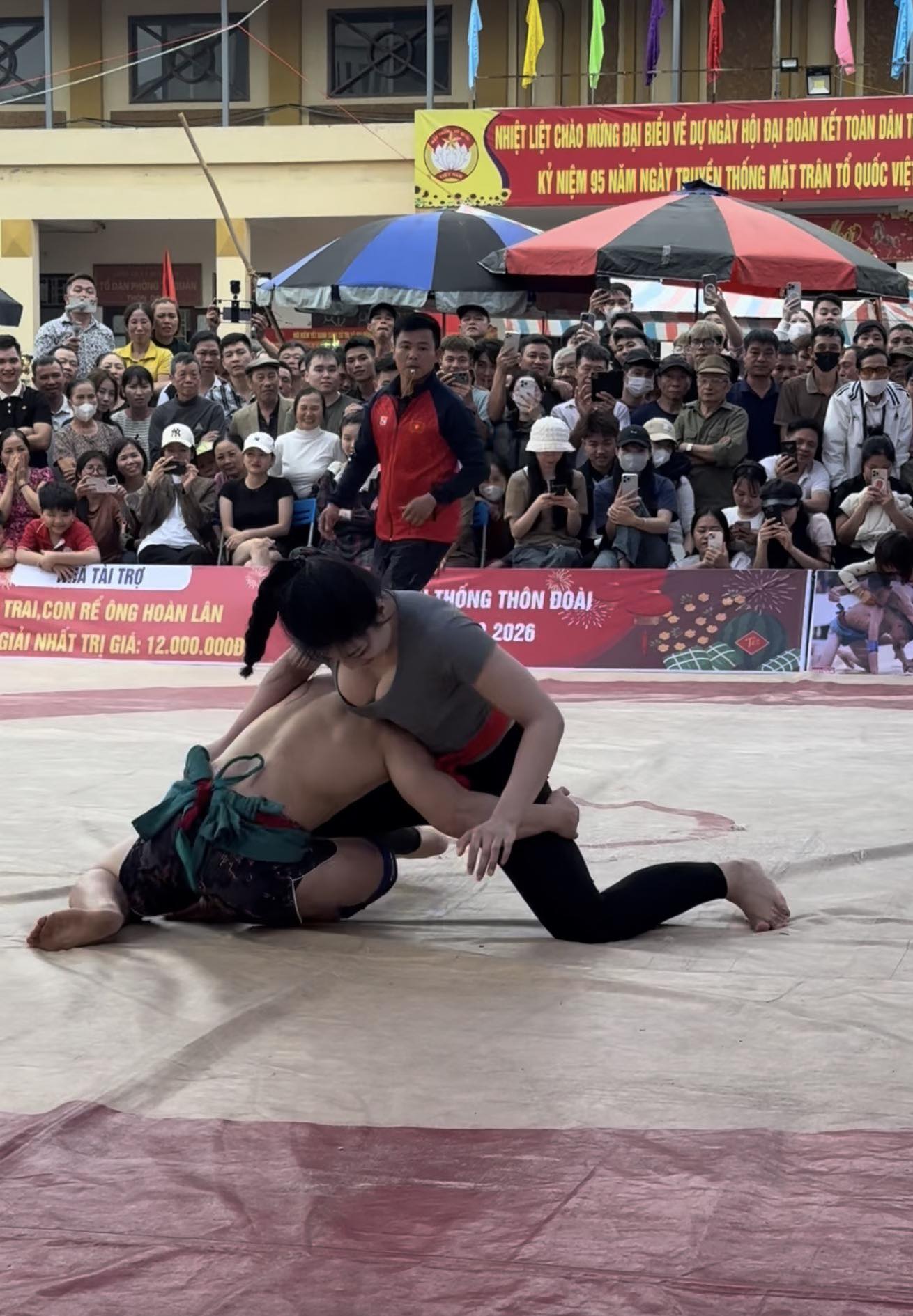 Anh Tho in wrestling gear focused and fierce