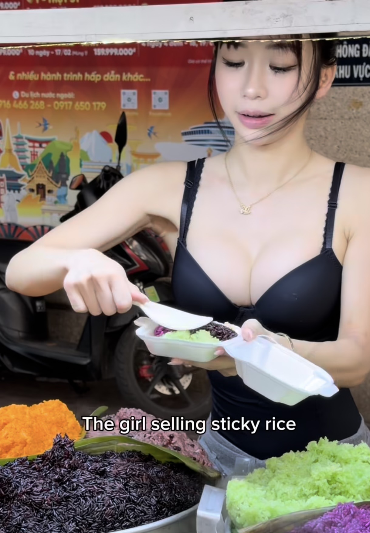 Luna serving colorful sticky rice at a street stall in Vietnam