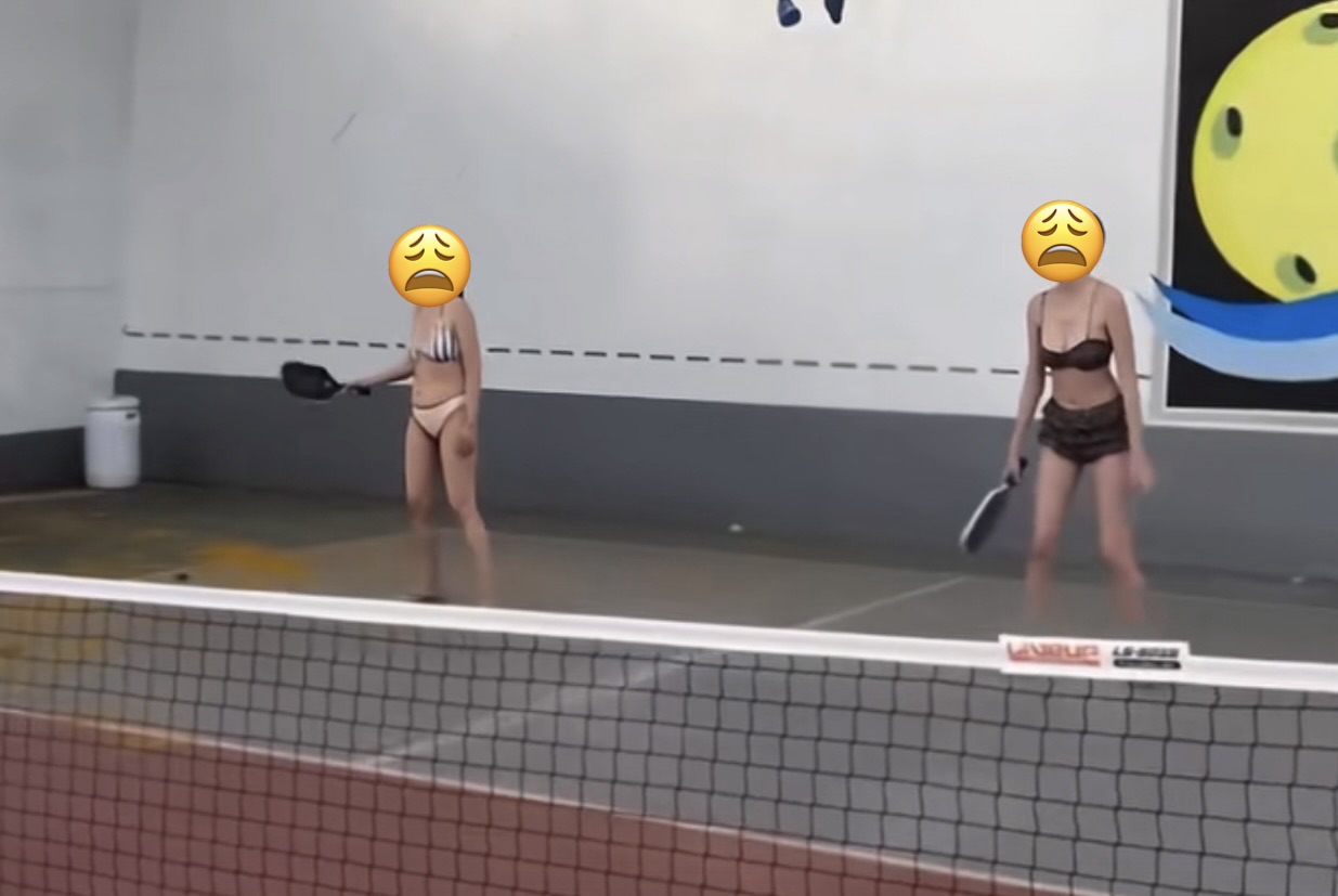 Two girls playing pickleball in swimsuits