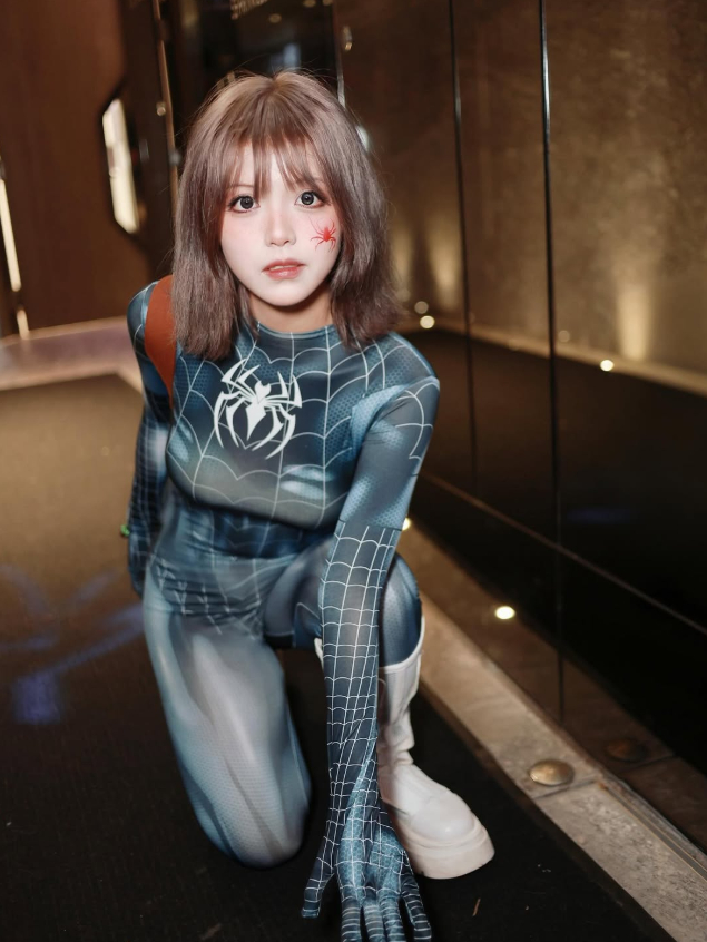 Full-body shot of Black Spider-Woman cosplay