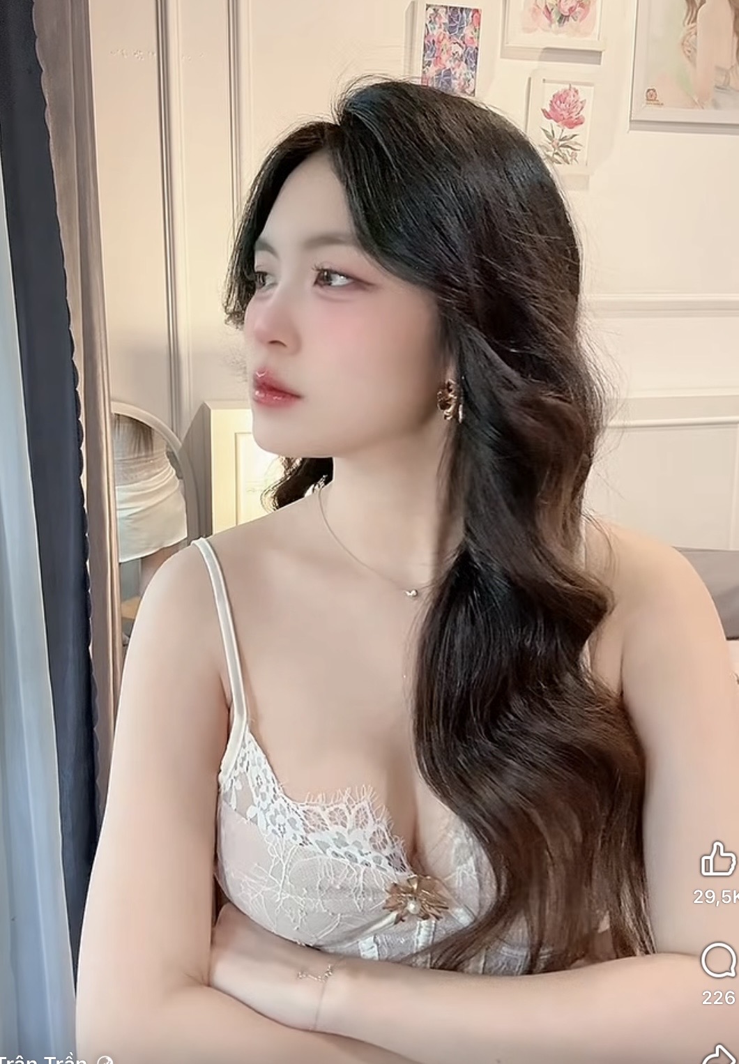 Tran Tran looking away thoughtfully