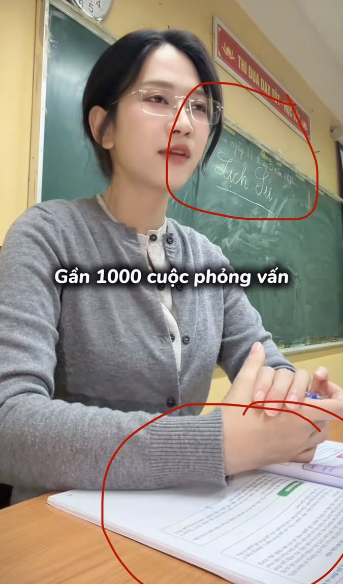 Le Bong focused flipping through a book in casual outfit