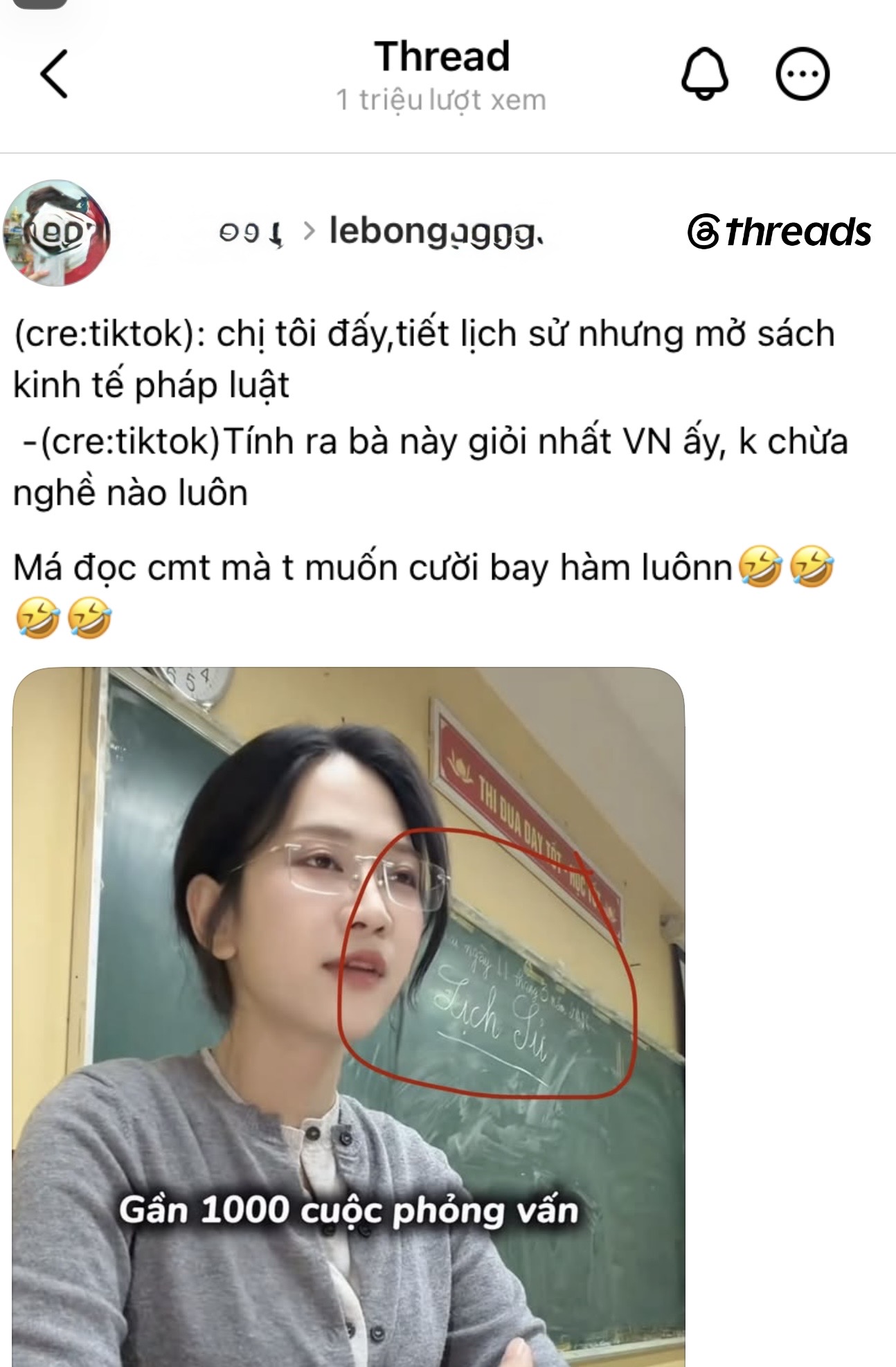 Le Bong reading Law Economics book while History lesson shows on board