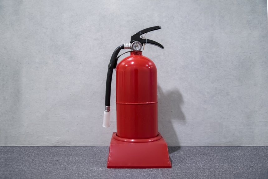 Two high school girls spraying fire extinguisher foam inside PC bang