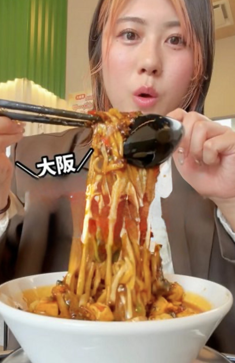 Miki enjoying spicy ramen