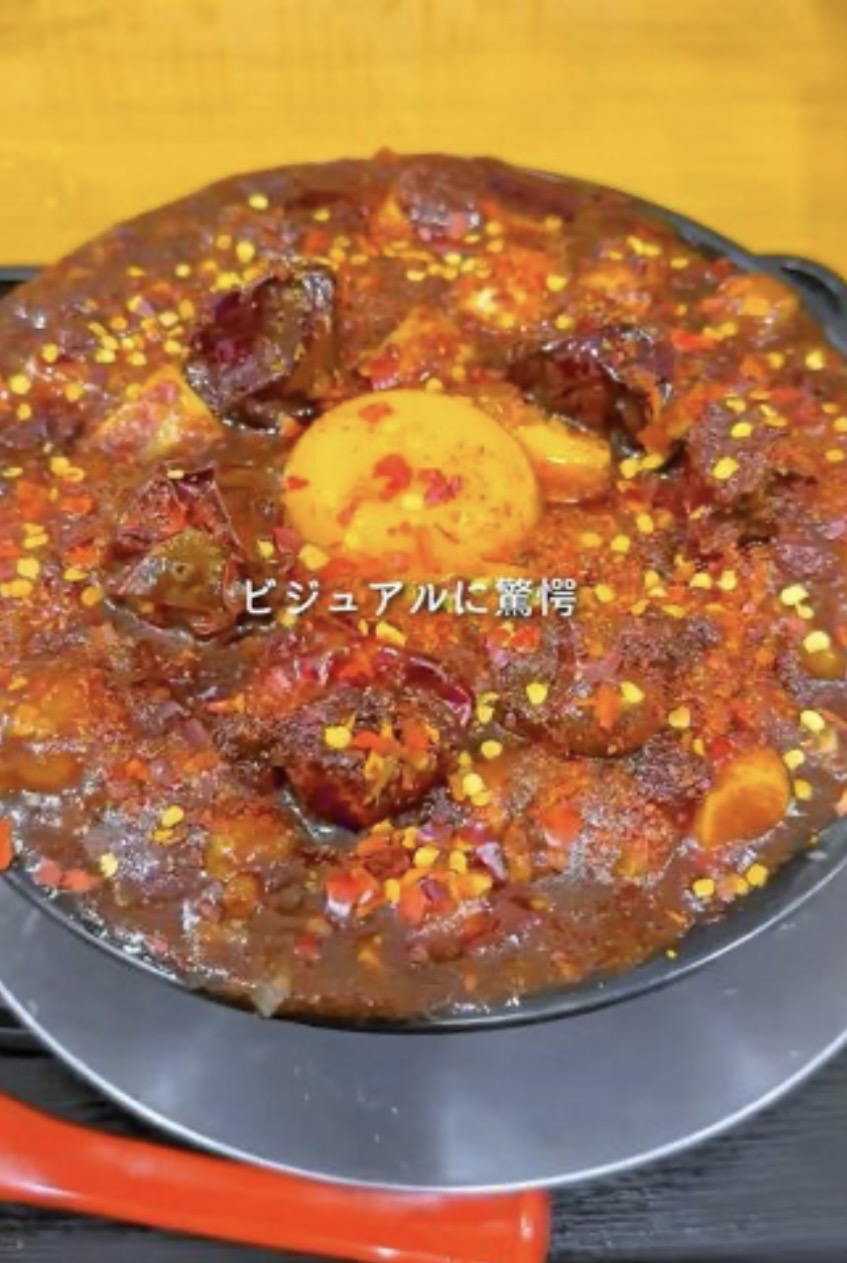 Close-up of fiery ramen bowl