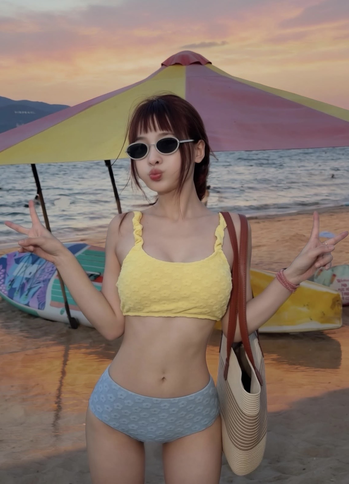 Ngoc Kem posing in swimwear