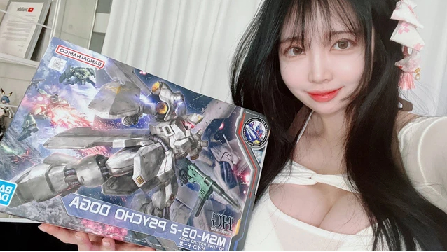 Shojo assembling Gundam model