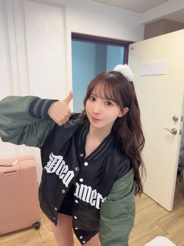 Yua Mikami playing basketball in white tank top and denim shorts