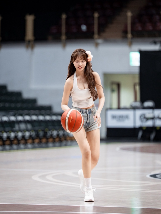 Yua Mikami posing on basketball court