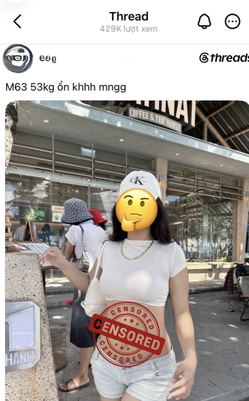 Young woman in tight crop top and very short denim shorts at coffee shop