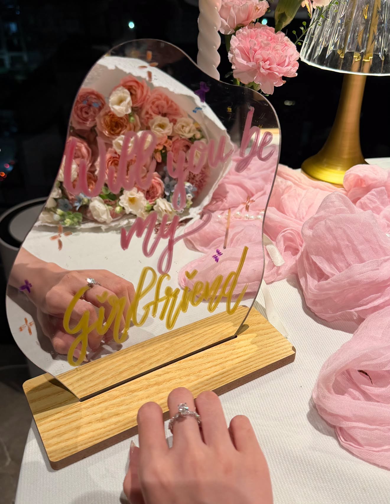 Close-up of the Darry Ring diamond ring on Pun’s hand
