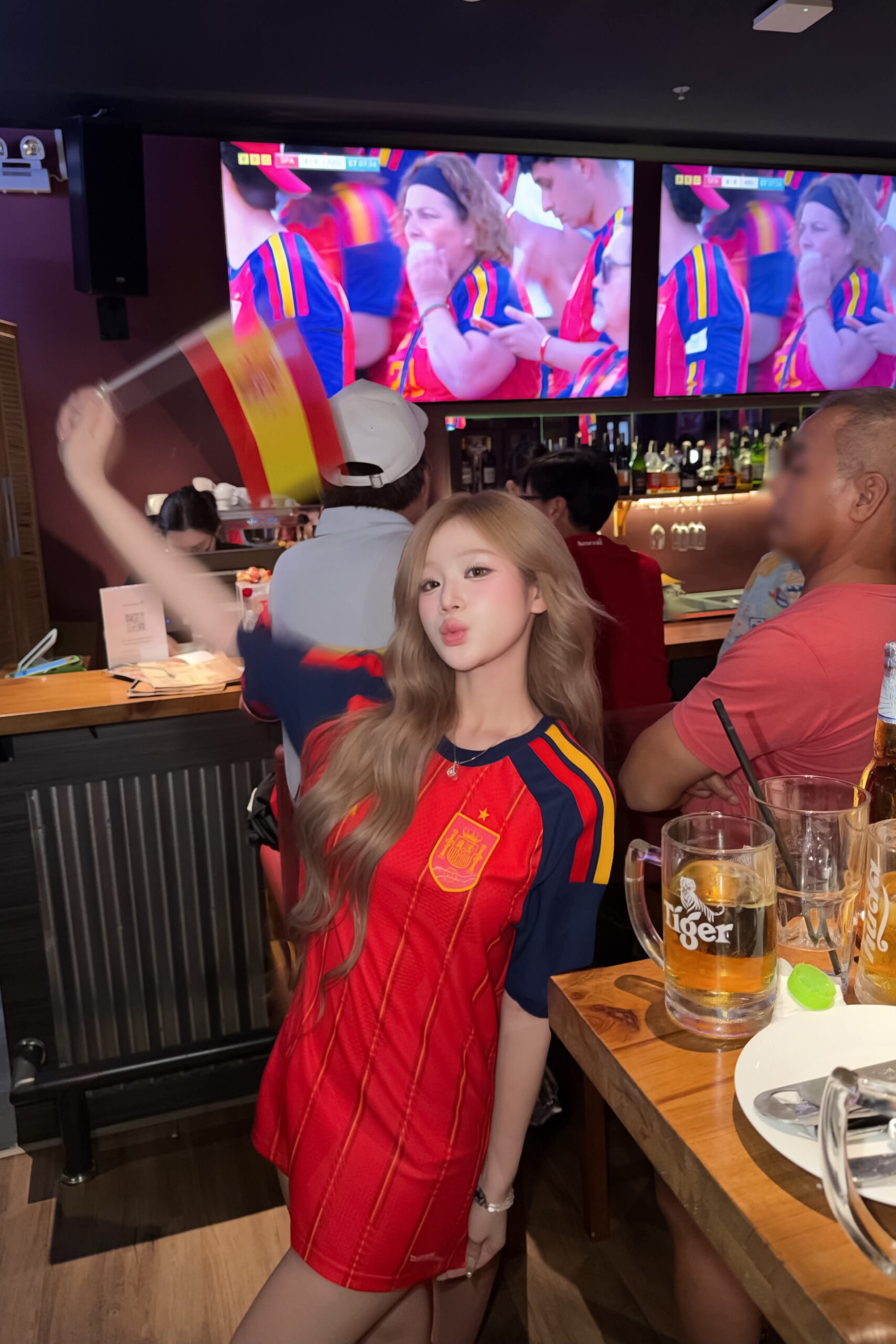 Spanish Football Fan Steals the Spotlight with Sweet Look 1 Spanish football fan in red jersey