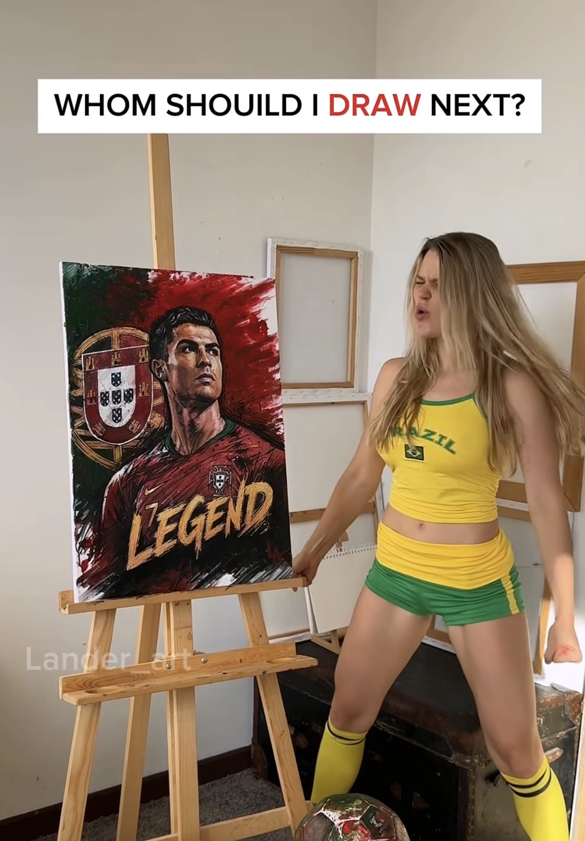 Artist Lander_art Paints Ronaldo Portrait Using a Soccer Ball 7 Lander_art posing with her artwork