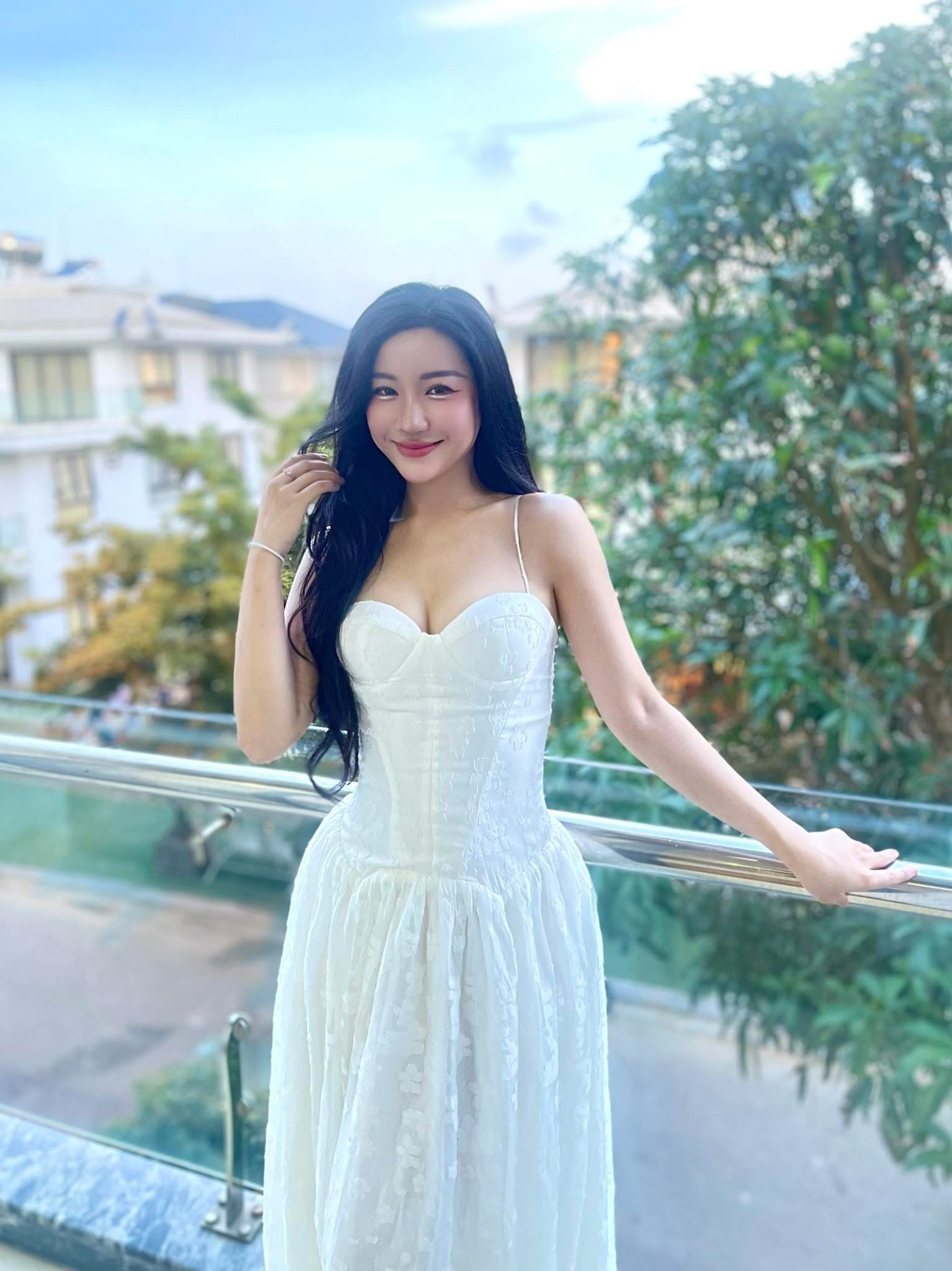 Flowing, elegant gowns that highlight her slim figure and porcelain skin under stage lights.