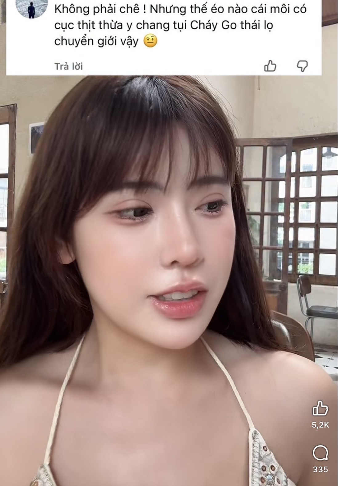 Una Tố Uyên looking serious in her video