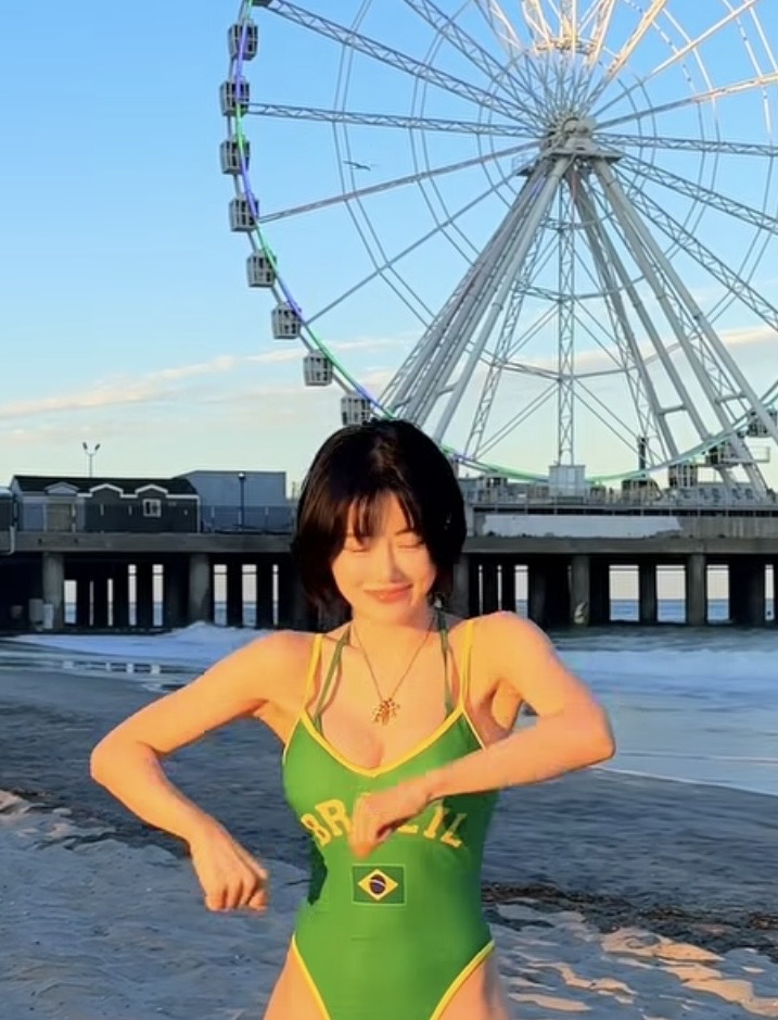 DJ Soda in Brazil-inspired yellow and green outfit on the beach