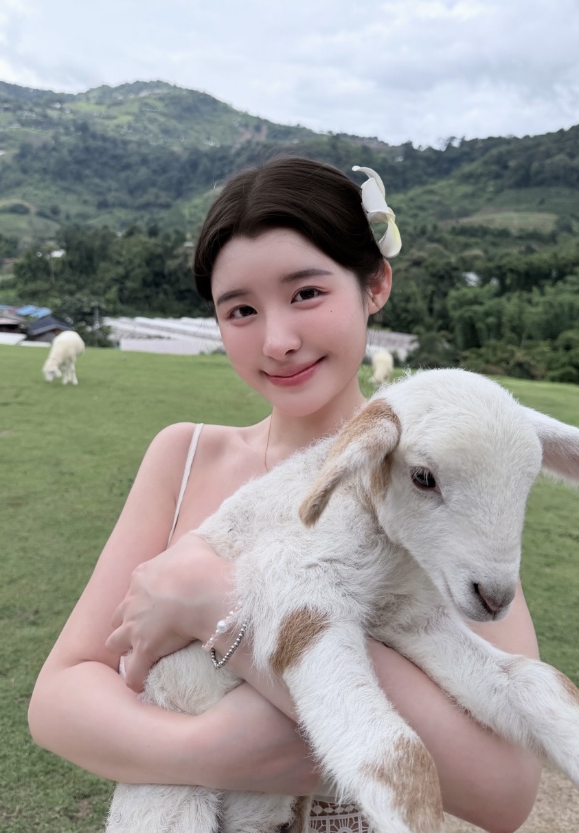 Cosplayer Sparks Debate with Bold Outfit at Sheep Farm 3 Cosplayer cocopie.cos bending down in revealing dress