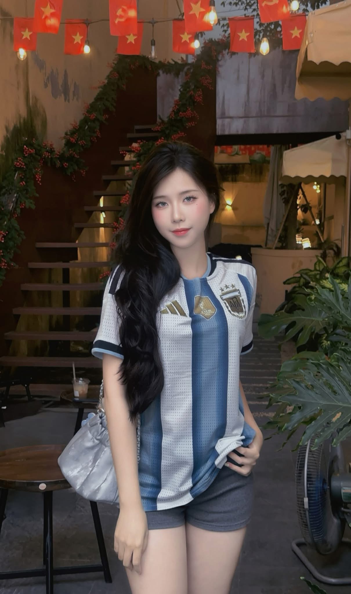 Actress from 'The Chairman' Rocks Argentina Jersey as a Casual Fan 2 Close-up of actress in Argentina jersey