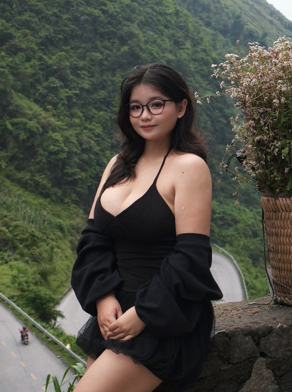 Hotel Management student in black dress with glasses