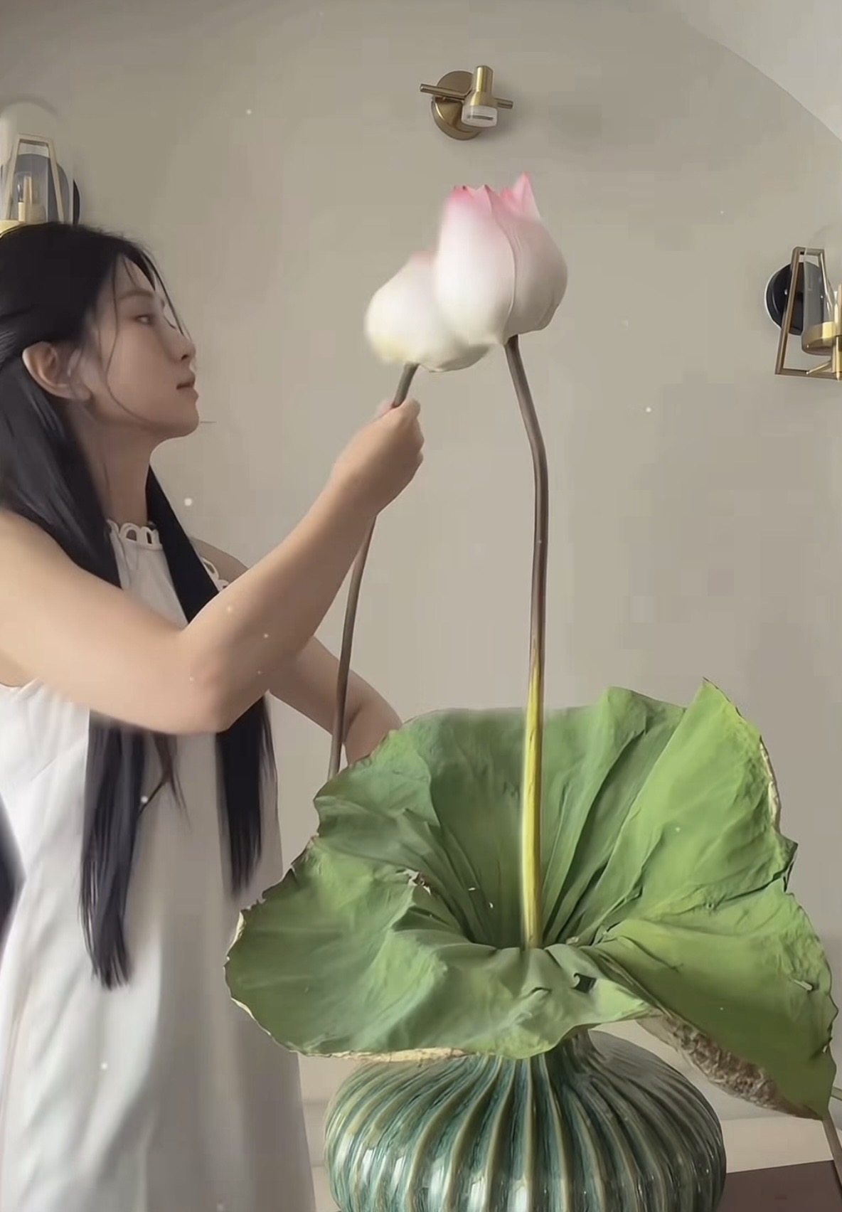 Le Bong posing with lotus flowers